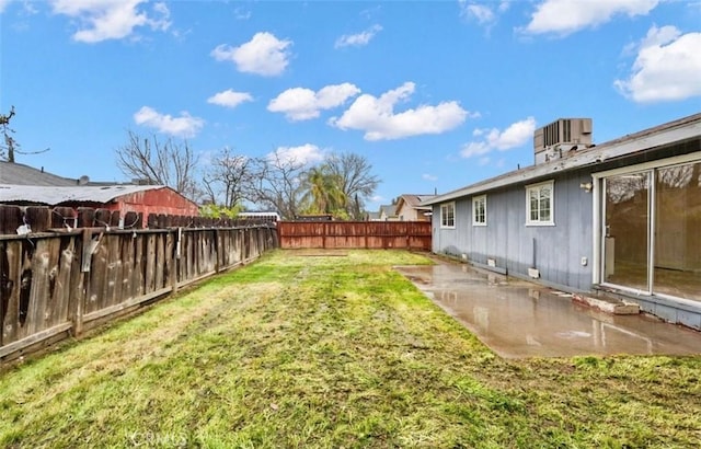 view of yard with a fenced backyard and cooling unit