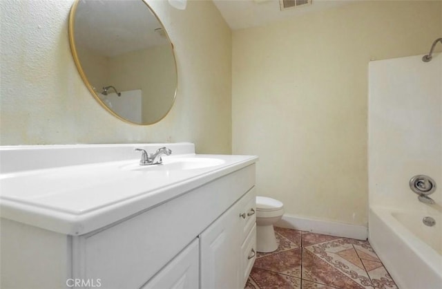 bathroom featuring toilet, shower / bath combination, vanity, baseboards, and tile patterned floors