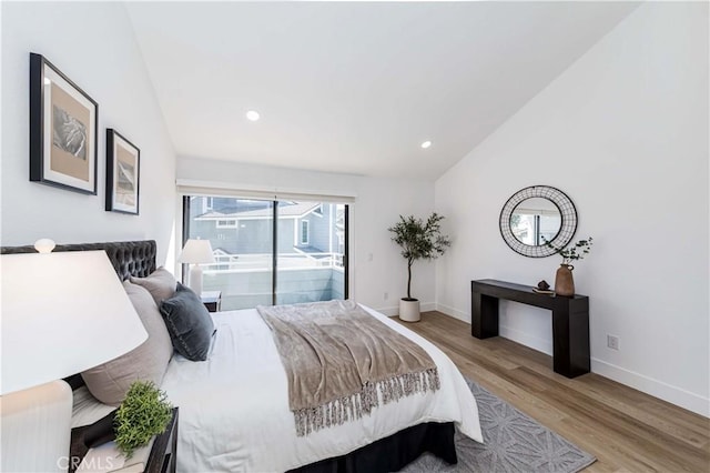 bedroom featuring baseboards, lofted ceiling, wood finished floors, access to exterior, and recessed lighting