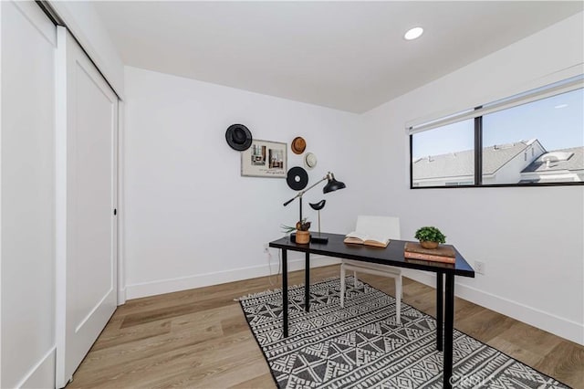 office area featuring recessed lighting, light wood-type flooring, and baseboards