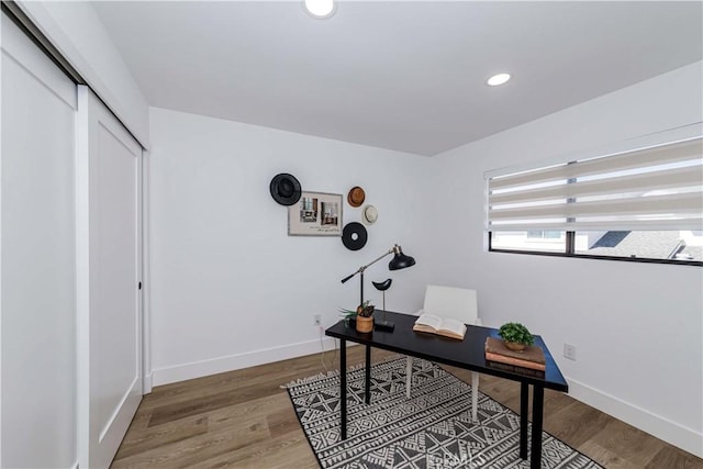 office area with baseboards, wood finished floors, and recessed lighting