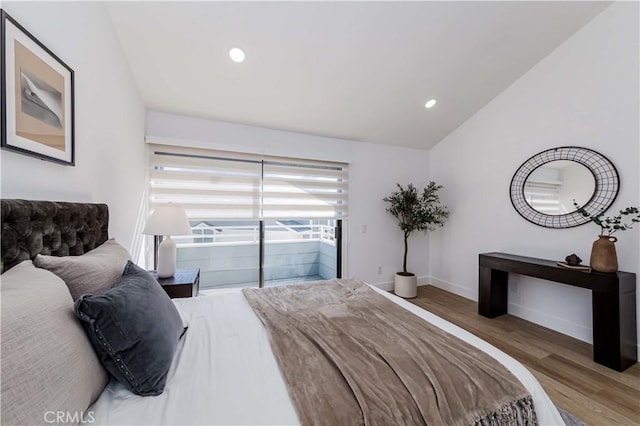 bedroom featuring recessed lighting, wood finished floors, baseboards, vaulted ceiling, and access to outside