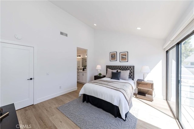 bedroom with light wood finished floors, recessed lighting, visible vents, connected bathroom, and access to outside