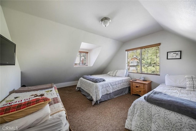 carpeted bedroom featuring vaulted ceiling and baseboards