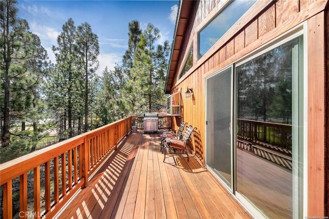 wooden deck featuring area for grilling