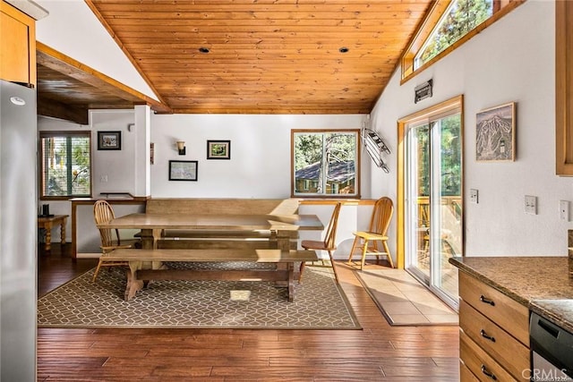 dining area featuring wooden ceiling, hardwood / wood-style flooring, and vaulted ceiling