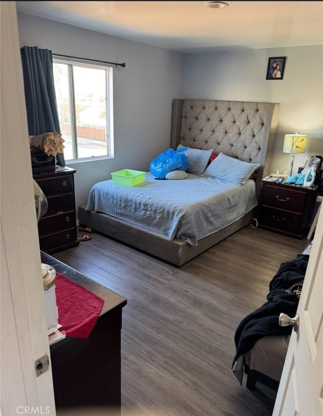 bedroom featuring wood finished floors