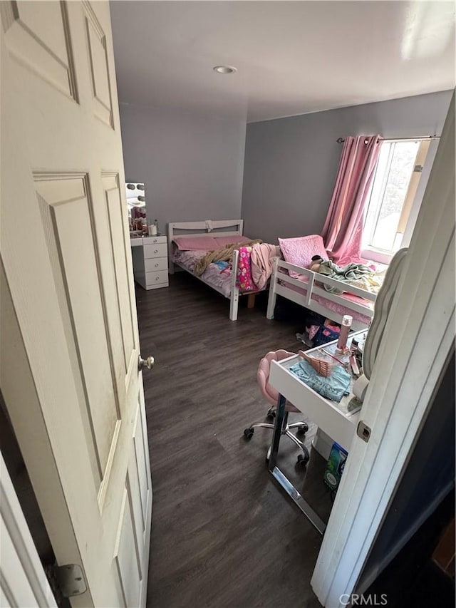 bedroom featuring dark wood finished floors