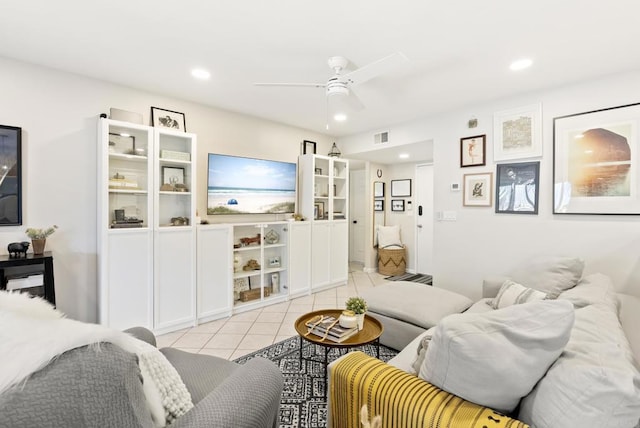 living area with light tile patterned floors, recessed lighting, visible vents, and ceiling fan