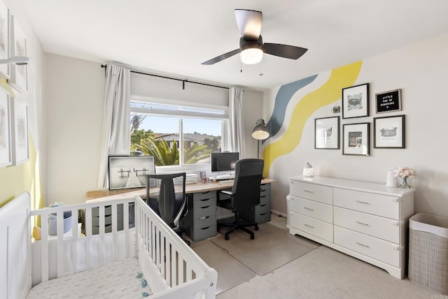 bedroom featuring light colored carpet and a ceiling fan