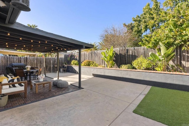 view of patio with a fenced backyard and grilling area