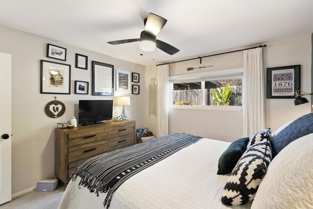 bedroom with carpet flooring, baseboards, and ceiling fan