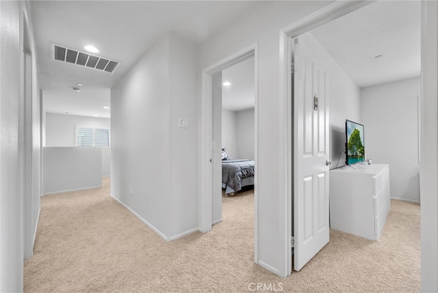 corridor with recessed lighting, baseboards, visible vents, and carpet flooring