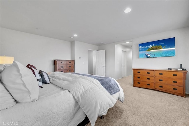 carpeted bedroom with recessed lighting