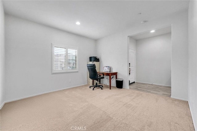 carpeted office featuring recessed lighting and baseboards