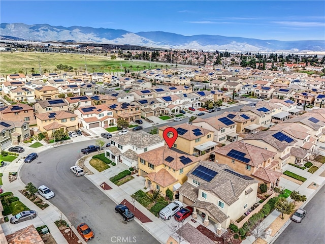 aerial view featuring a mountain view and a residential view