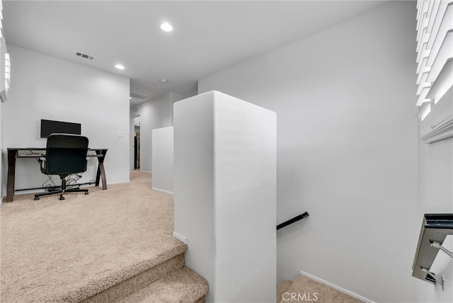 carpeted office with recessed lighting and visible vents