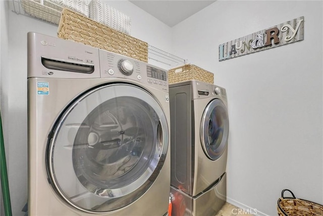 washroom with laundry area and washing machine and clothes dryer