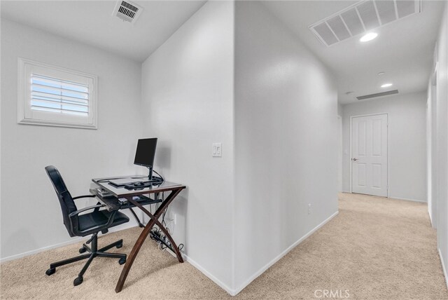 office with baseboards, visible vents, and carpet flooring