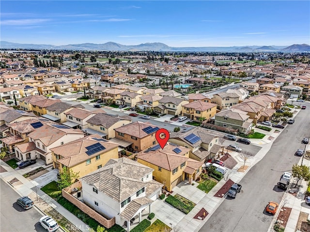 drone / aerial view featuring a mountain view and a residential view