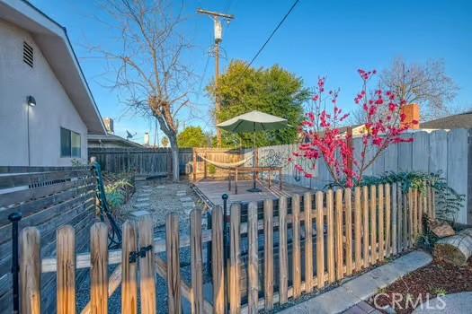 view of gate with a fenced backyard