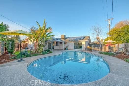 view of pool featuring a patio area, a fenced backyard, and a fenced in pool