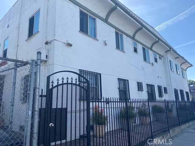 view of building exterior featuring fence private yard