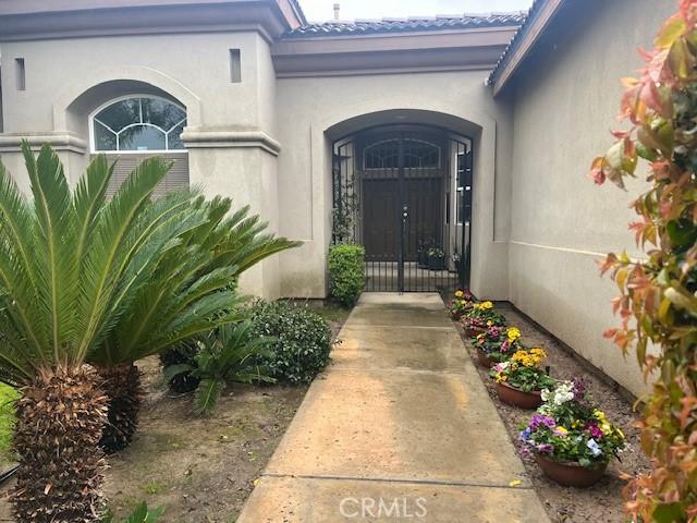 view of exterior entry with stucco siding