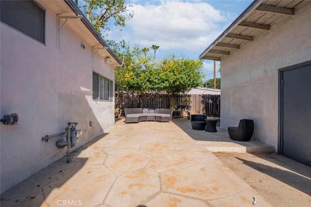 view of patio / terrace featuring fence and an outdoor living space