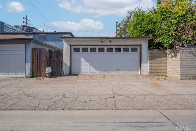 garage with fence