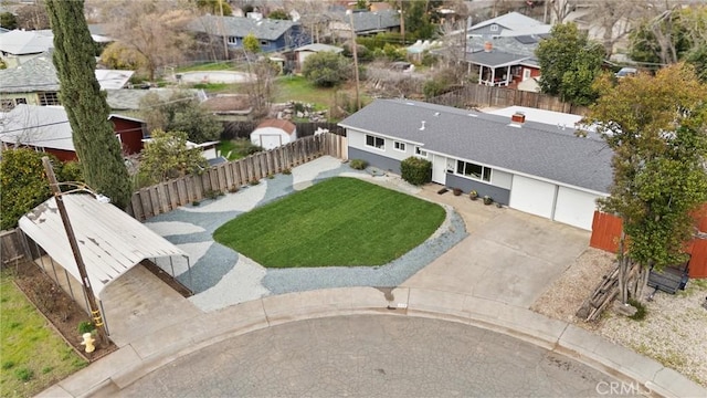 birds eye view of property with a residential view