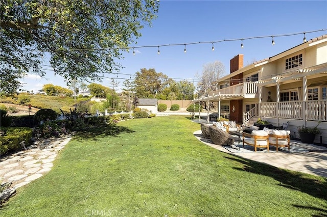 view of yard featuring a patio area, fence, and an outdoor living space