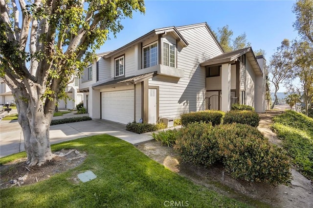 view of front of property featuring a garage and concrete driveway