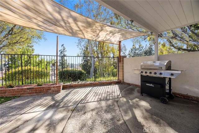 view of patio / terrace featuring fence and grilling area