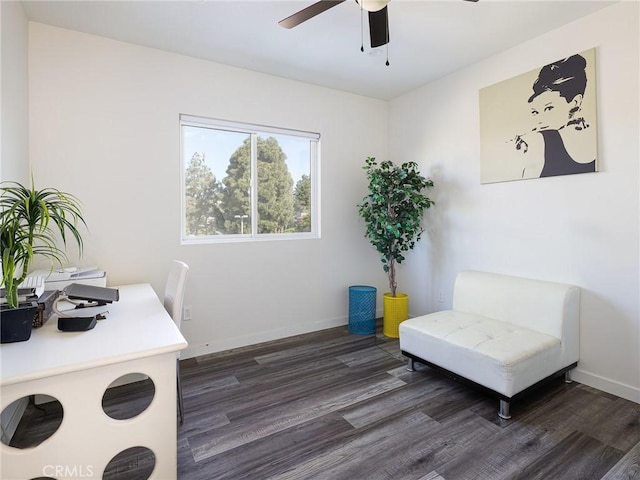 home office featuring a ceiling fan, dark wood-style flooring, and baseboards