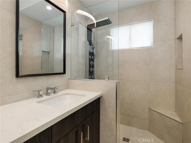 bathroom featuring vanity and walk in shower