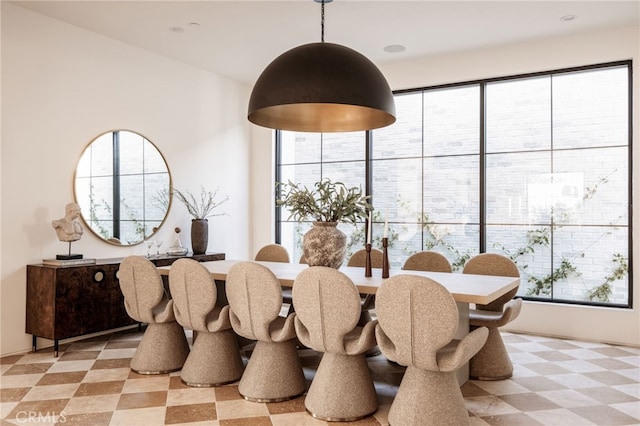 dining space featuring plenty of natural light and light floors