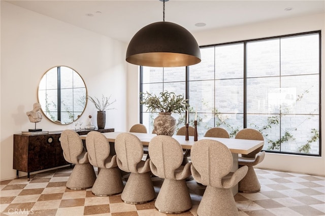 dining space with a healthy amount of sunlight and light floors