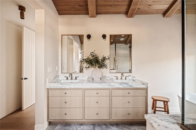 bathroom with double vanity, beamed ceiling, wooden ceiling, and a sink