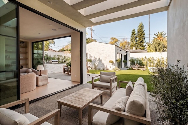 view of patio / terrace featuring an outdoor living space and an outbuilding