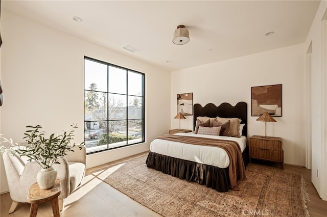 bedroom with visible vents and recessed lighting