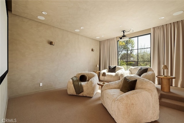 carpeted home theater room featuring baseboards