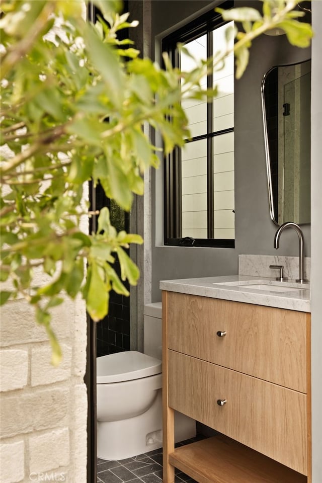 half bath with vanity and toilet