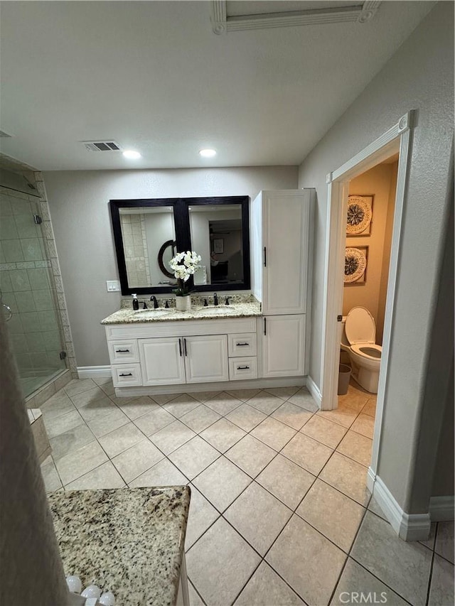 full bathroom featuring double vanity, a shower stall, visible vents, and tile patterned floors