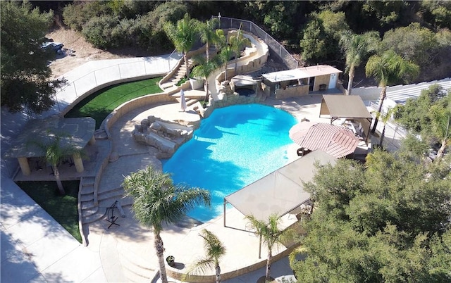 view of pool with stairway, a fenced in pool, and a patio