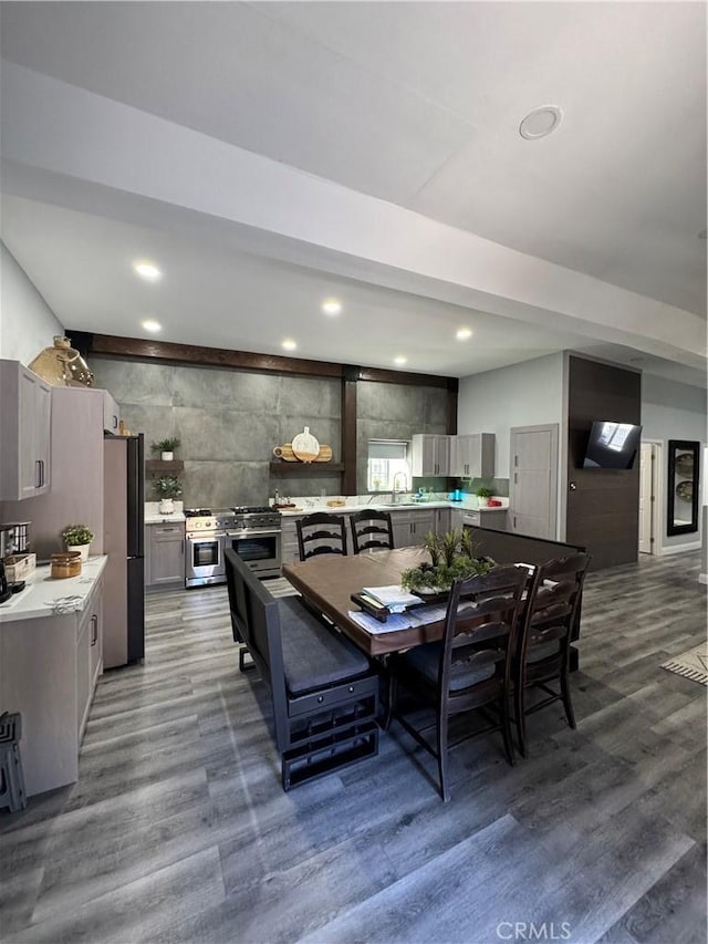 dining room featuring wood finished floors and recessed lighting