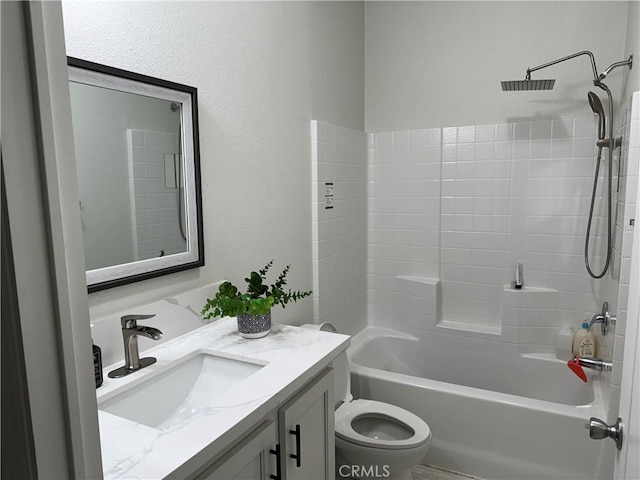 bathroom featuring bathtub / shower combination, vanity, and toilet