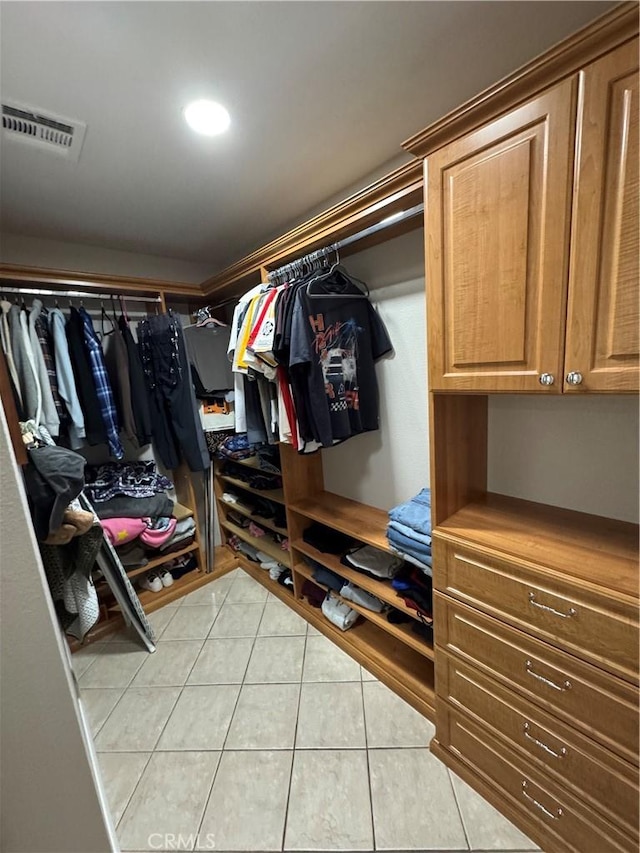 spacious closet with light tile patterned floors and visible vents