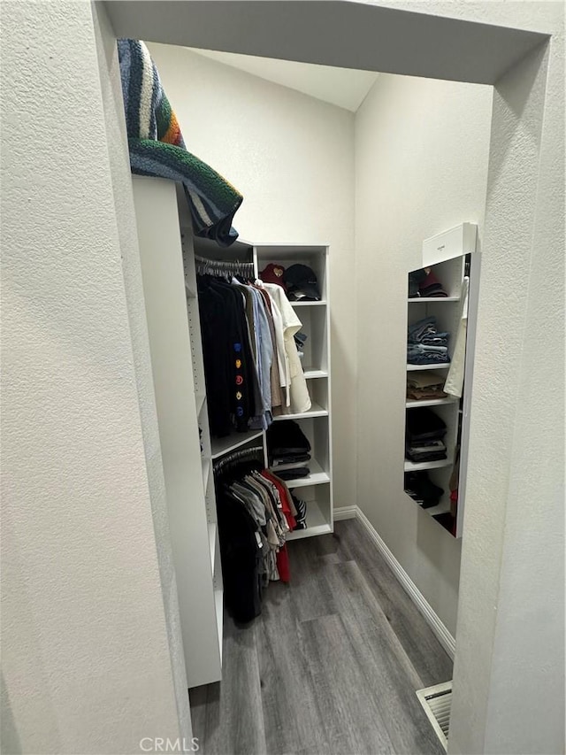 spacious closet with wood finished floors and visible vents