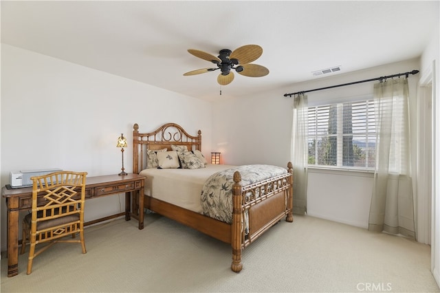 bedroom with visible vents, baseboards, a ceiling fan, and carpet flooring